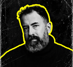 Dave Clarke in a black-and-white artist portrait against a dark background with a yellow outline.