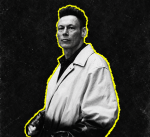 Luke Slater of Planetary Assault Systems in a light coat, pictured in black and white with a yellow outline.