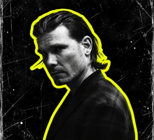 Marcel Dettmann looking over his shoulder, in a black-and-white portrait with a yellow silhouette outline.